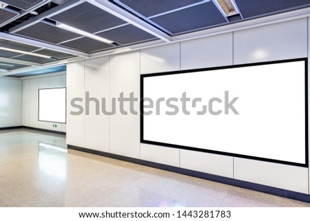 Blank advertising display in subway station underpass public area