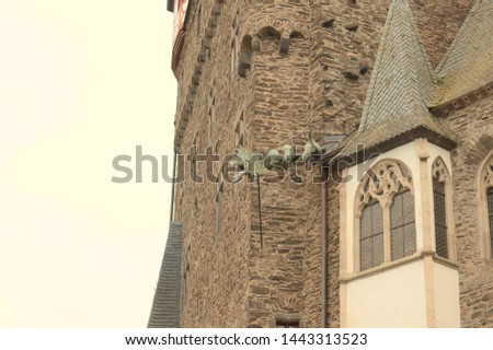 Ornamental dragon on the roof of a medieval tower (Germany, Europe)