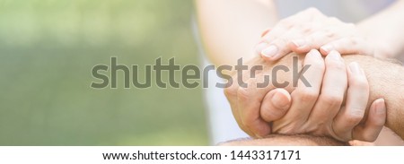 Caring nurse helping senior man sitting on bench in gaden. Asian woman, caucasian man. Holding hands, with copy space. Web banner frame. Royalty-Free Stock Photo #1443317171