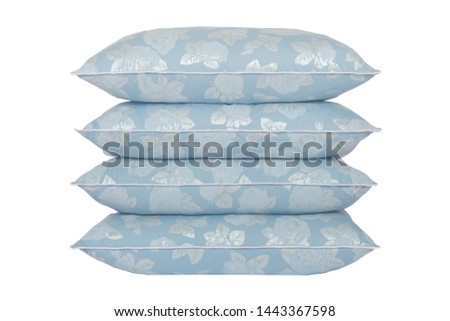 stack of four blue pillows with silver rose pattern isolated on a perfect white background, white fringe, stock photography