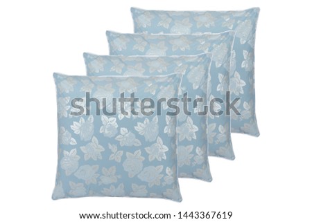 stack of four square blue pillows with silver rose pattern isolated on a perfect white background, white fringe, stock photography