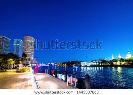 Tampa riverwalk under a clear sky at night. Florida, USA