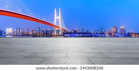 Shanghai Nanpu bridge and empty square floor scenery at night,China