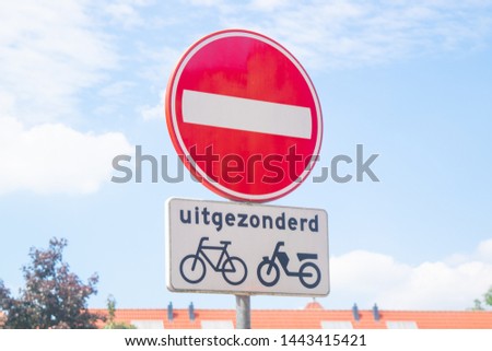 Dutch road sign: a directional traffic except for bicycle and moped