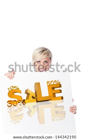 Portrait of a smiling young woman with sale sign on poster against white background