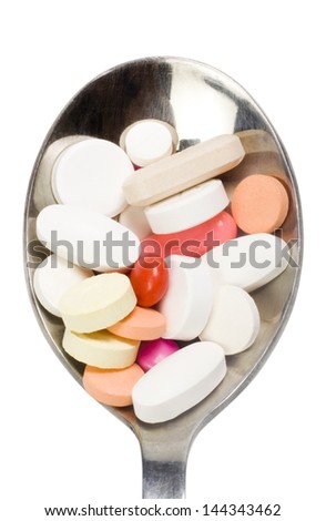 Close-up of a spoon full of medicines