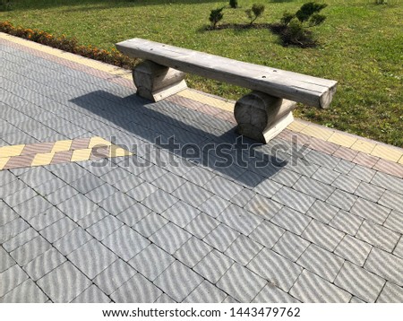 Nested pavers of various colors, around the grass, chic garden