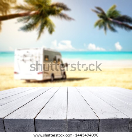 Wooden desk of free space for your decoration and summer beach background 