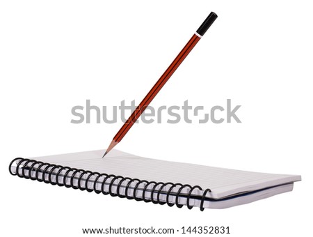 Close-up of a pencil on a spiral notebook