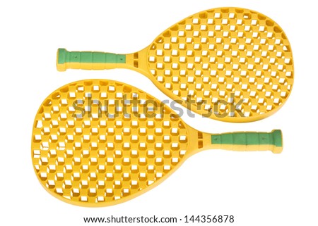 Close-up of a pair of toy tennis rackets