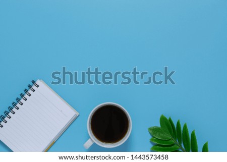 Top view notebook,pen, or object for office supply concept on blue background.