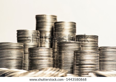 A lot of coins, selective focus.Front view of stacks of Euro coins.Concept photo.Coins close-up on the table. Simple and minimalistic design .