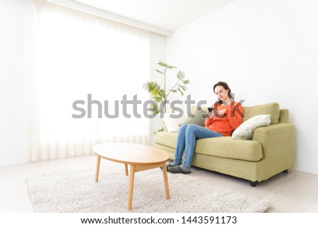 Young women using a smartphone at home