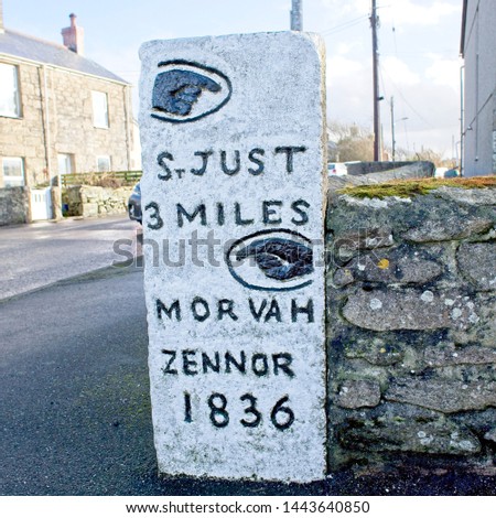 Ancient milestone dated 1836, at a road junction in west Cornwall, England, UK.