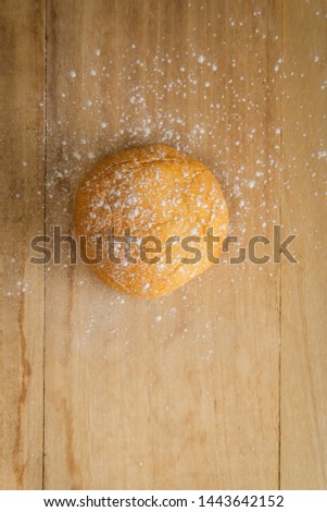 fresh home baked sweet bread  topping with icing sugar on wood table