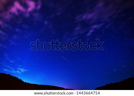 Midsummer night sky with satellite traces.