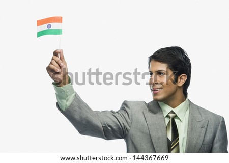 Close-up of a man holding an Indian flag
