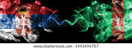Serbia vs Turkmenistan, Turkmenistans smoky mystic flags placed side by side. Thick colored silky smokes combination of Serbian and Turkmenistan, Turkmenistans flag
