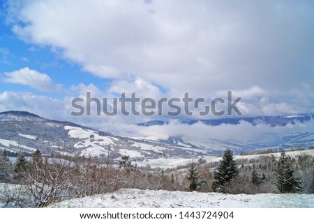View of the Carpathian mountains covered with snow in a winter sunny frosty day                             