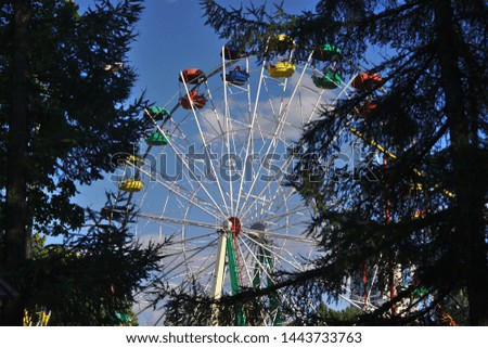 Ferris wheel with multicolored cabins