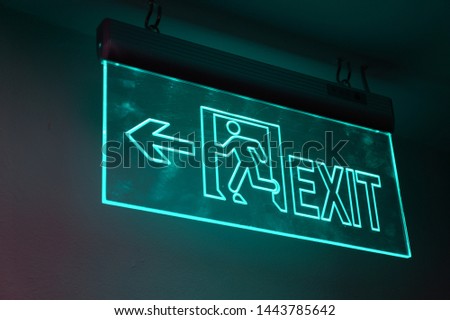 blue mint green light exit sign