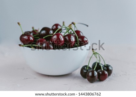 Fresh sweet cherry in a white plate. fresh ripe cherries. cherries.