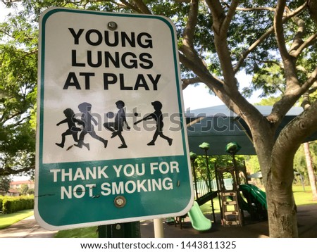 Close up contemporary no smoking sign in public park