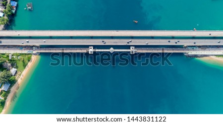 Aerial top view drone shot of bridge with cars on bridge road image transportation and travel background concept.
