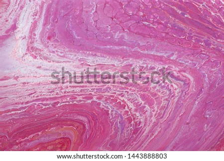 photography of abstract marbleized effect background. red, pink and white creative colors. Beautiful paint