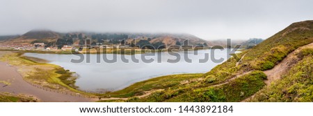 Rodeo Lagoon and Fort Cronkhite on the Pacific Ocean coastline, on a cloudy day, Marin Headlands, Marin County, California Royalty-Free Stock Photo #1443892184