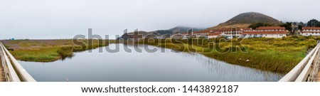Rodeo Lagoon and Fort Cronkhite on the Pacific Ocean coastline, on a cloudy day, Marin Headlands, Marin County, California Royalty-Free Stock Photo #1443892187