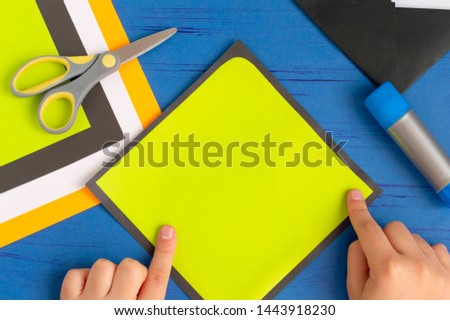 How to make original envelopes for Halloween greetings. Children's art project. DIY concept. Step-by-step photo instruction. Step 7. Glue yellow square to black