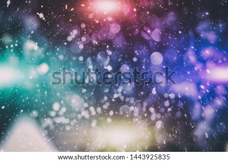 Festive Christmas background. Elegant abstract background with bokeh defocused lights and stars
