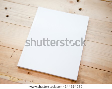 book cover white on wood table