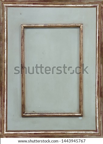 old dirty light blue wood panel bordered with antique golden line