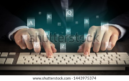 Business woman typing on keyboard with letters around