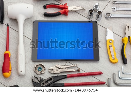 Household tools and tablet with grid screen concept