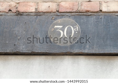Weathered and worn wooden signage