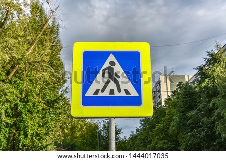 Road sign "Pedestrian crossing" in the city street