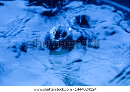drop of water splash in  blue color.