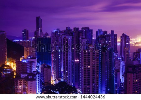 Famous view of Hong Kong at twilight sunset, sunrise. Hong Kong skyscrapers skyline cityscape illuminated in the evening. Hong Kong, special administrative region in China. China shopping market.