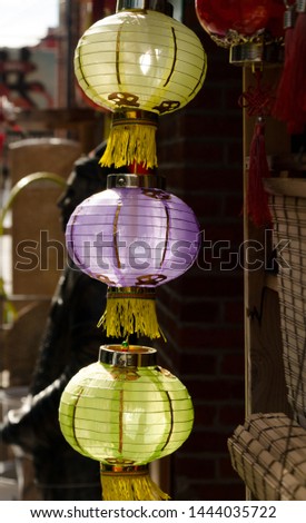 Yellow and purple   lanterns hanging  over Fisgard street in Chinatown, Victoria, British Columbia