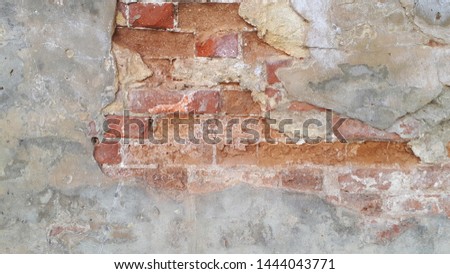 Old grunge crashed red brick wall