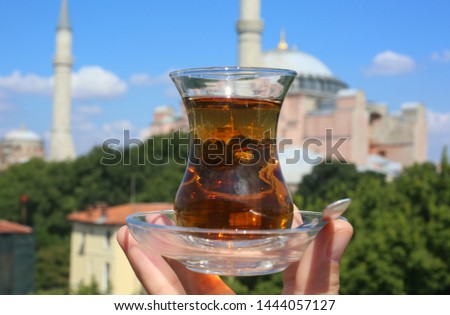 Traditional cup of Turkish tea on the background of Aya Sophia church in Istanbul Turkey. Beautiful view in Turkey. Travel in Turkey.