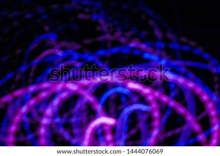 A messy blurry colourful neon abstract lines