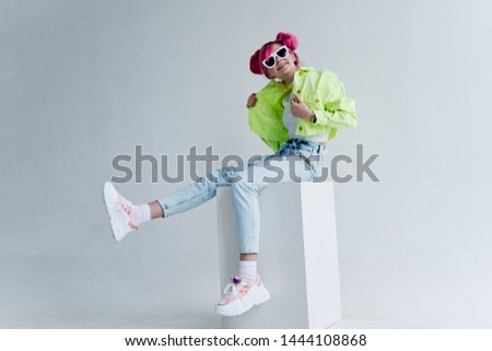 woman in stylish clothes, hair sits on a cube place free