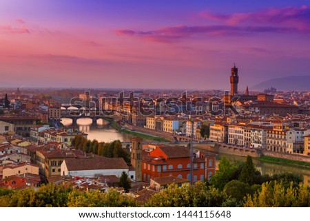 View of the beautiful medieval italian city and culture capital - Florence with cathedrals and bridges over river and cloudy sky at sunset. Travel outdoor sightseeing historical background.