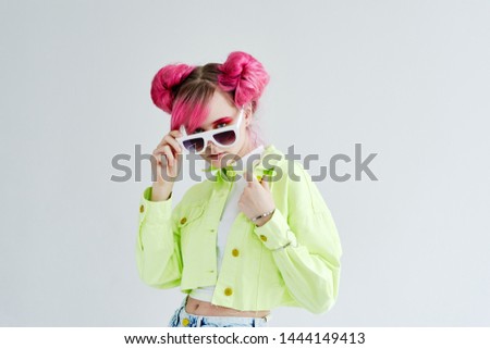 woman with pink hair in retro style glasses