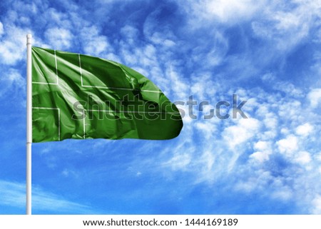 National flag of Ladonia on a flagpole in front of blue sky