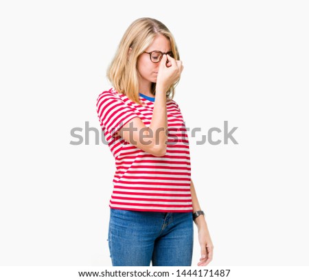 Beautiful young woman wearing glasses over isolated background tired rubbing nose and eyes feeling fatigue and headache. Stress and frustration concept.